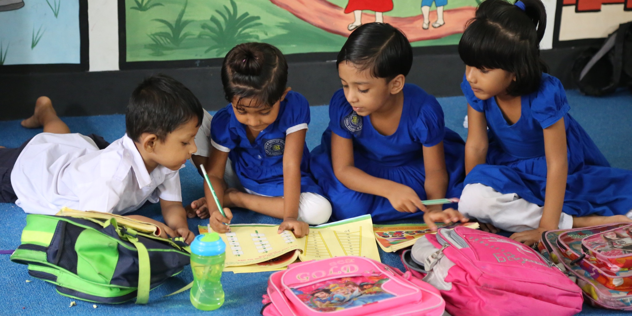 Students with their teacher during a lesson. Credit: World Bank