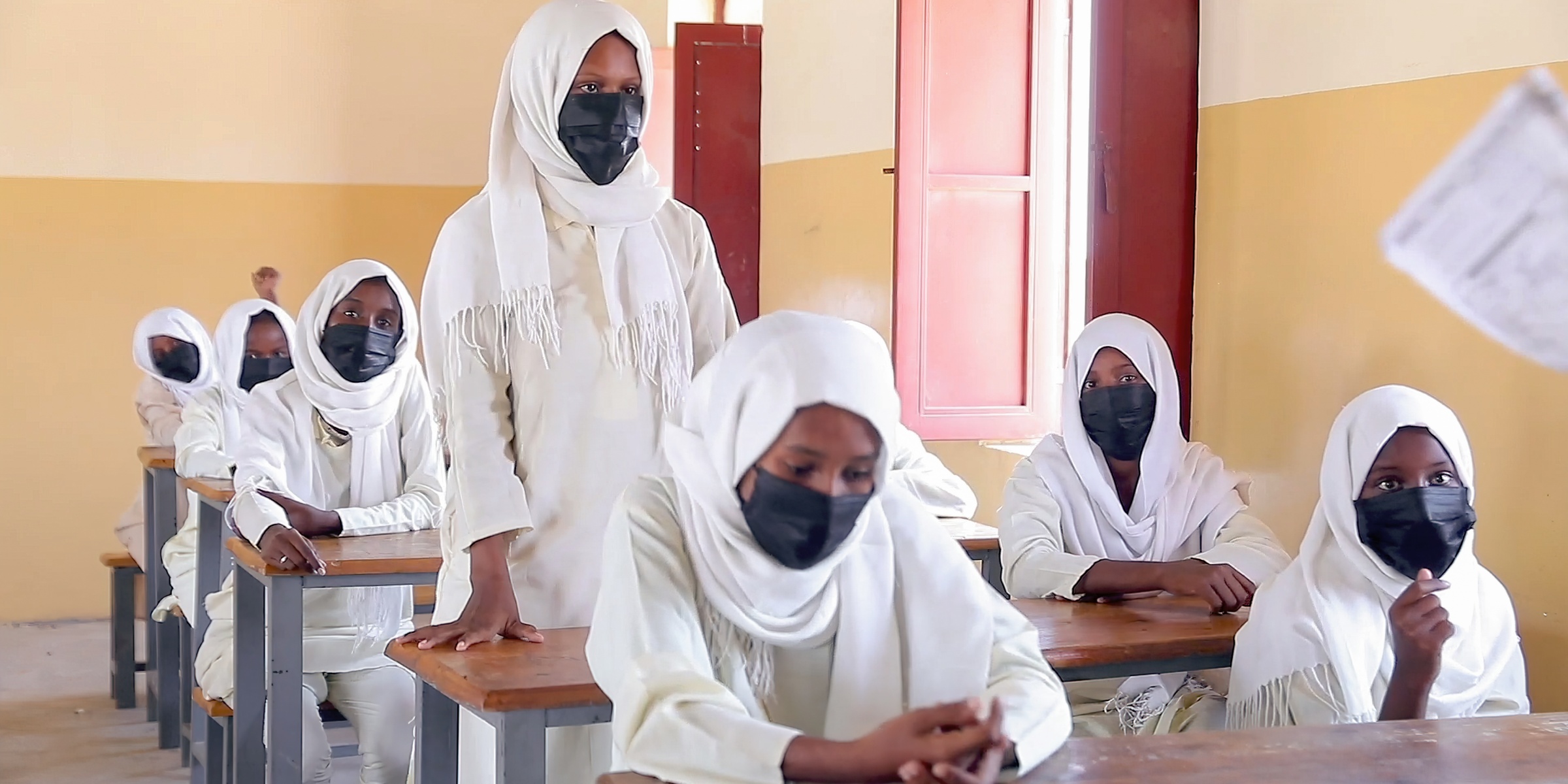A young student stands to answer a question in class. Sudan. Credit: GPE